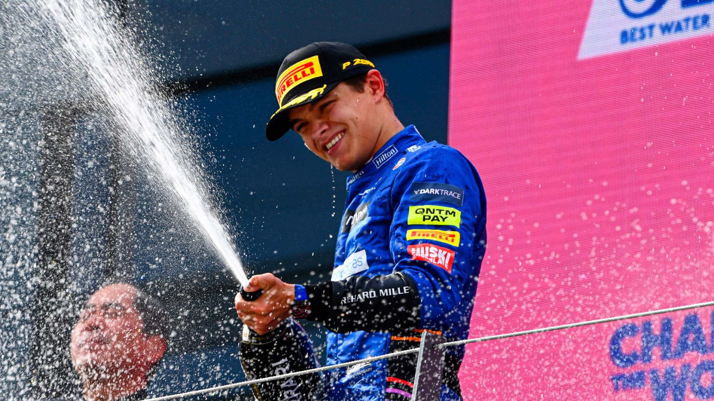 Lando Norris, McLaren, 3rd position, sprays Champagne from the