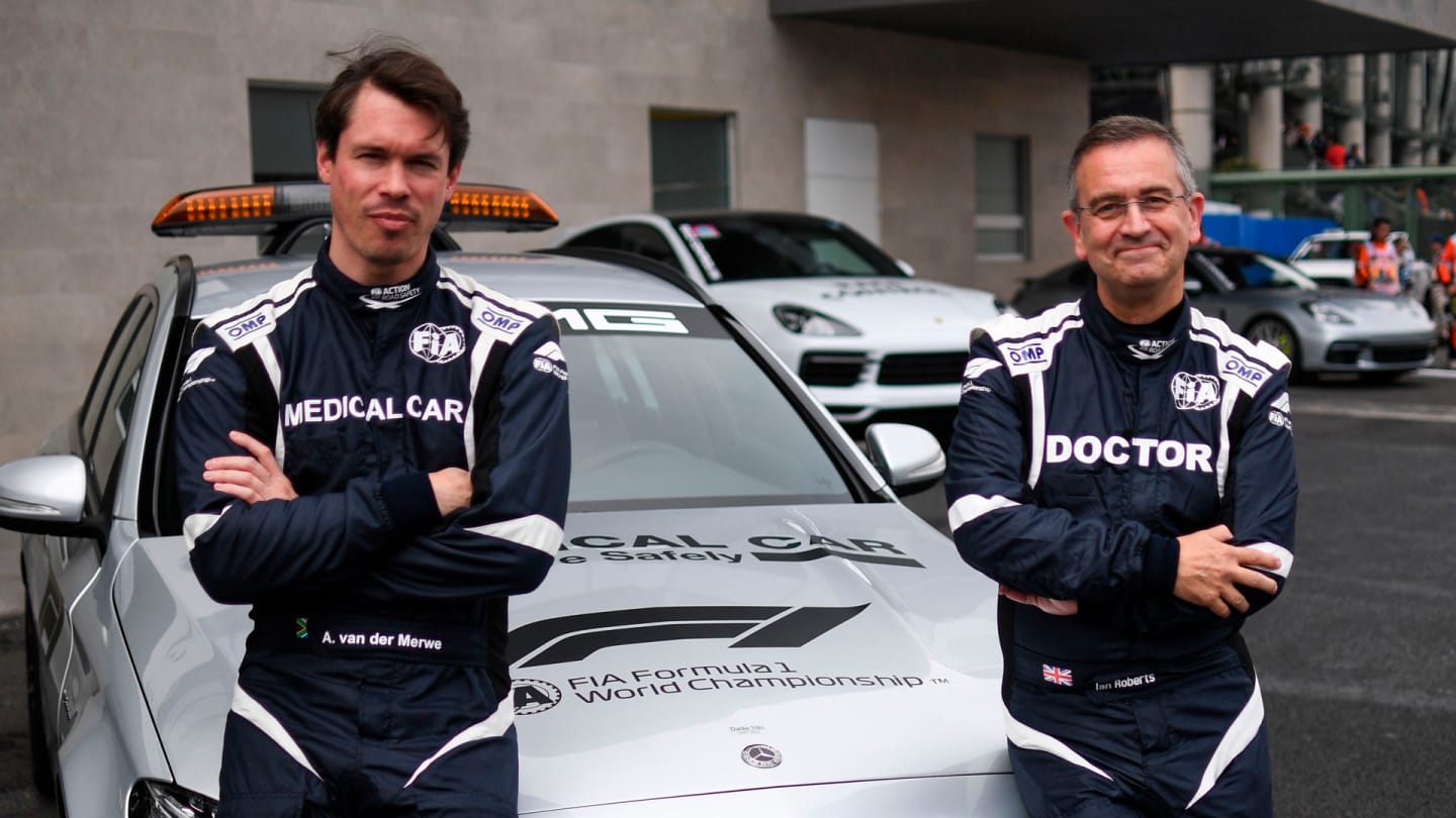South African Formula One medical car driver Alan Van Der Merwe (L) and British medical car doctor
