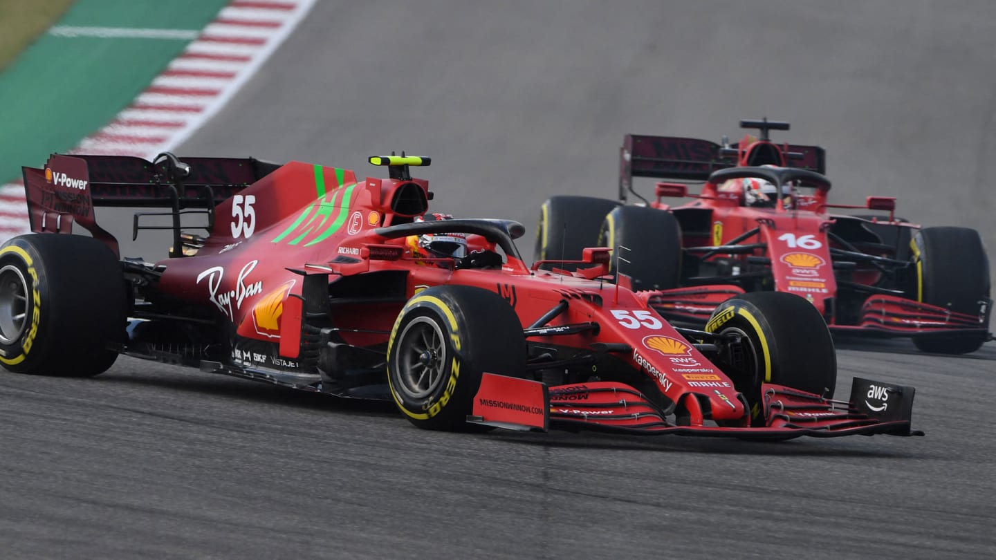 Ferrari's Spanish driver Carlos Sainz Jr (L) and Ferrari's Monegasque driver Charles Leclerc race
