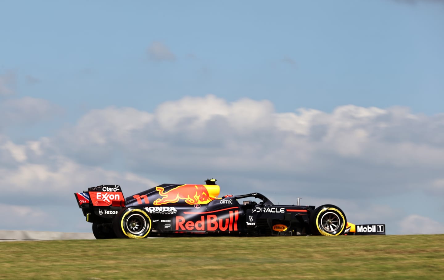 AUSTIN, TEXAS - OCTOBER 22: Sergio Perez of Mexico driving the (11) Red Bull Racing RB16B Honda