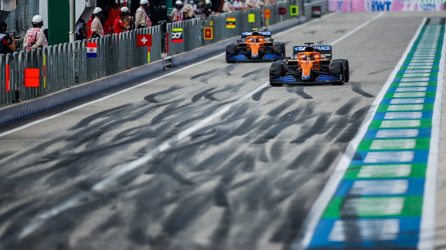 AUSTIN, TEXAS - OCTOBER 23: Lando Norris of McLaren and Great Britain and Daniel Ricciardo of