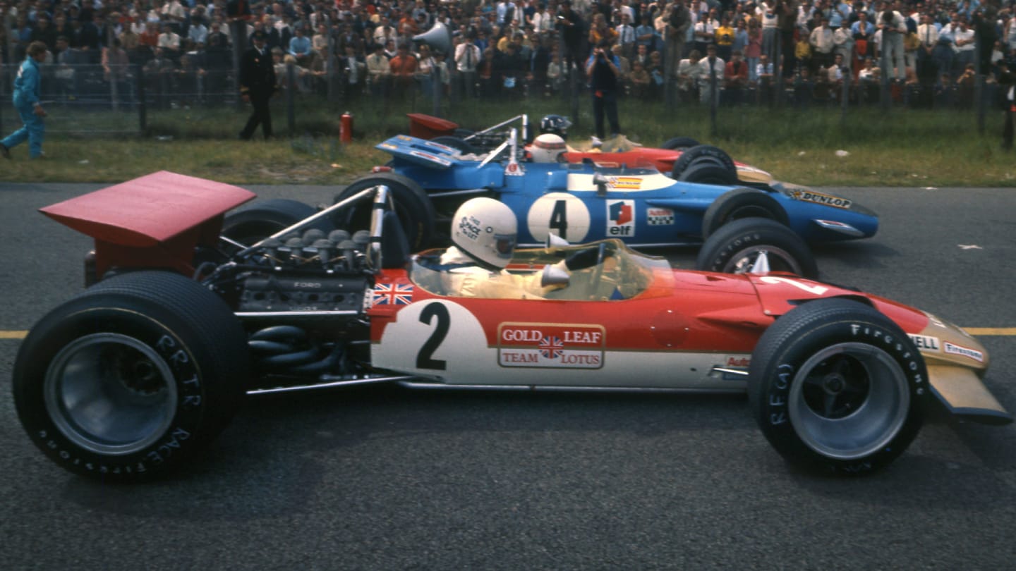 Jochen Rindt of Austria, driver of the #2 Gold Leaf Team Lotus Lotus 49B Ford V8 sits alongside