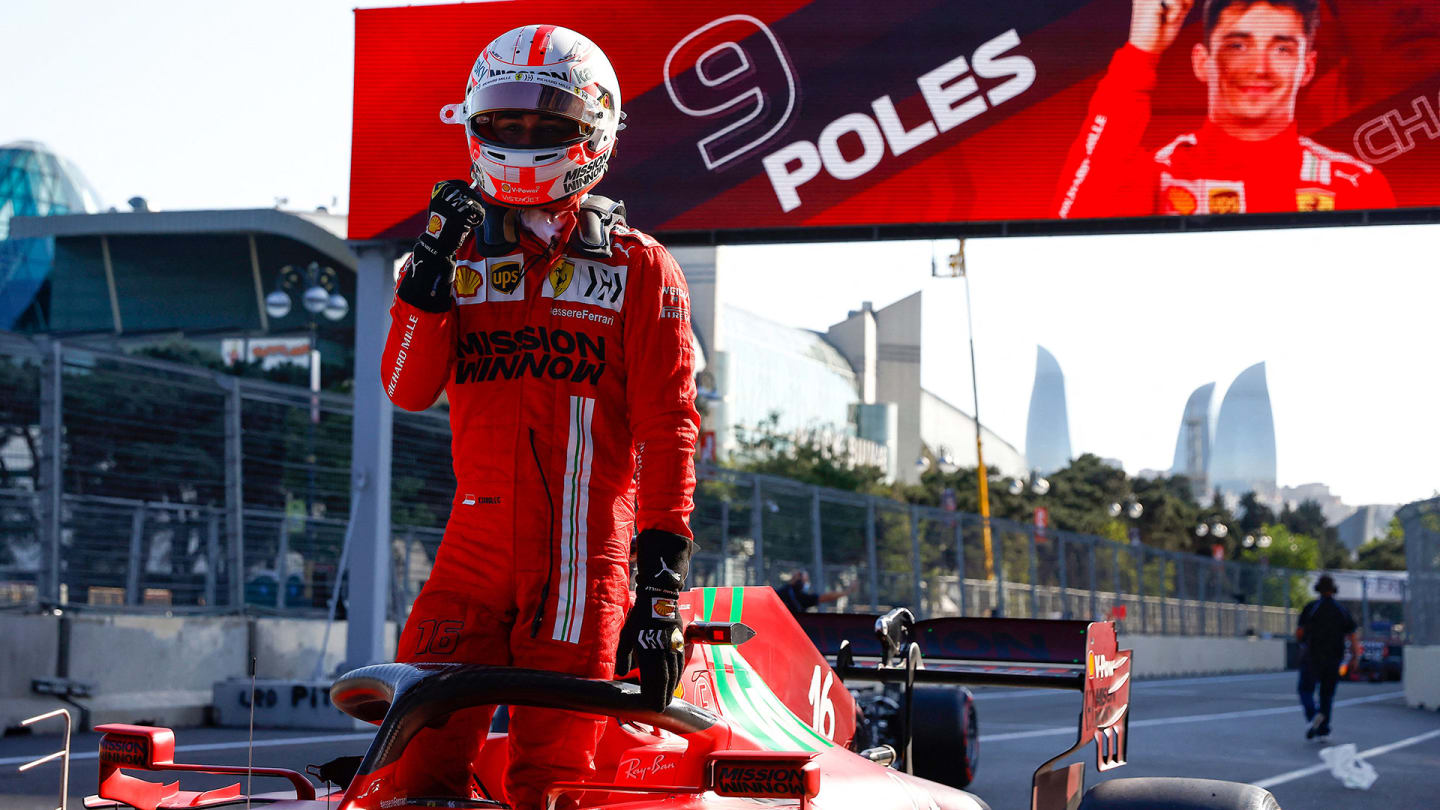 Ferrari's Monegasque driver Charles Leclerc celebrates after claiming pole position in the