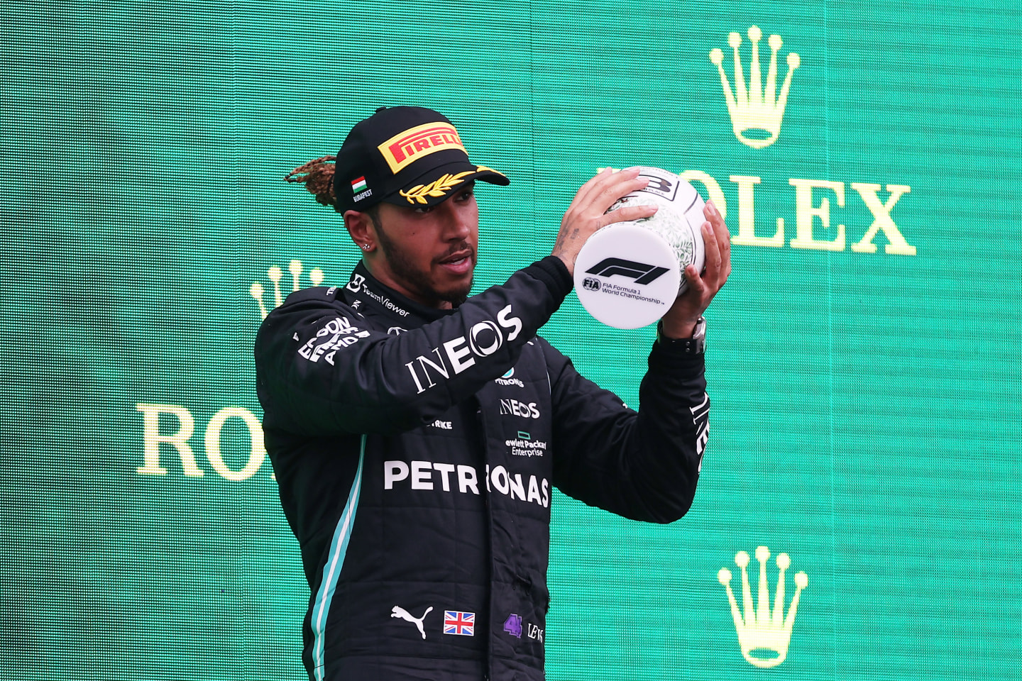BUDAPEST, HUNGARY - AUGUST 01: Third placed Lewis Hamilton of Great Britain and Mercedes GP celebrates on the podium during the F1 Grand Prix of Hungary at Hungaroring on August 01, 2021 in Budapest, Hungary. (Photo by Lars Baron/Getty Images)