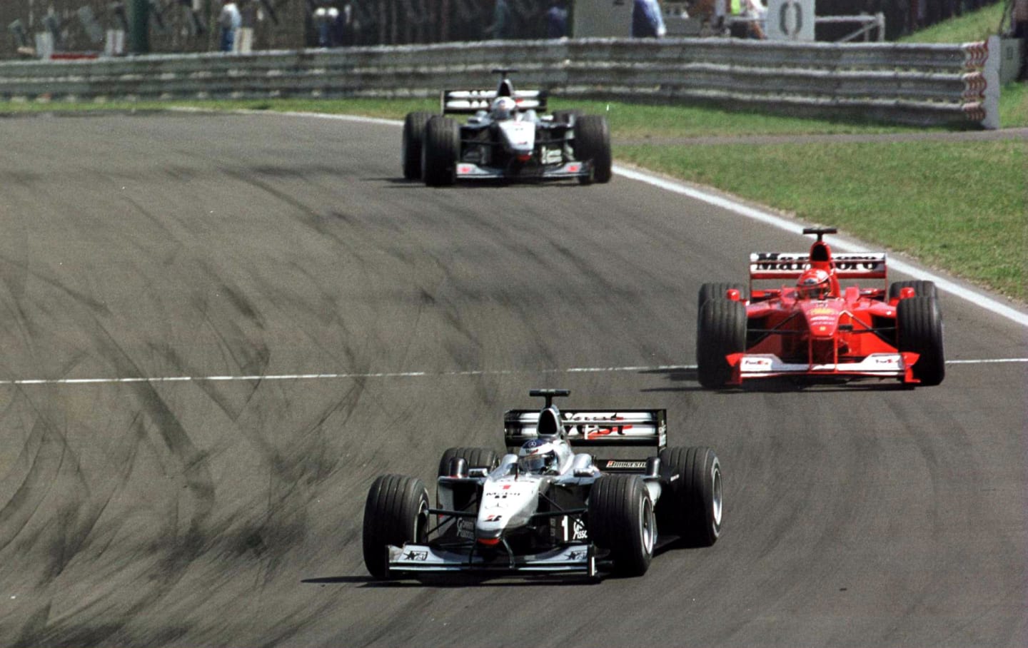 13 Aug 2000: Mika Hakkinen of Finland and McLaren leads the field ahead of Michael Schumacher of