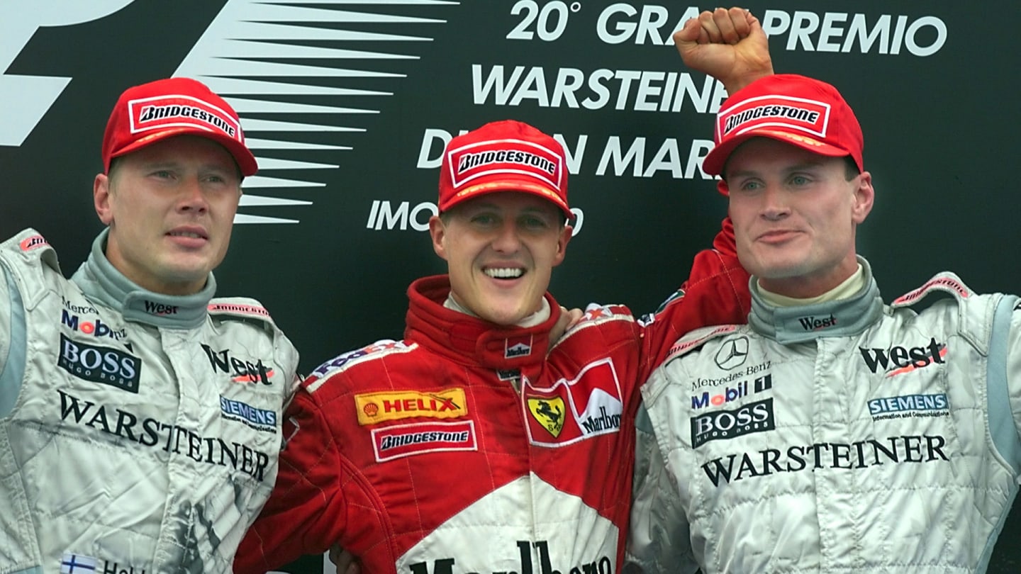 German Ferrari driver Michael Schumacher (C) Finnish McLaren-Mercedes driver Mika Hakkinen (L) and