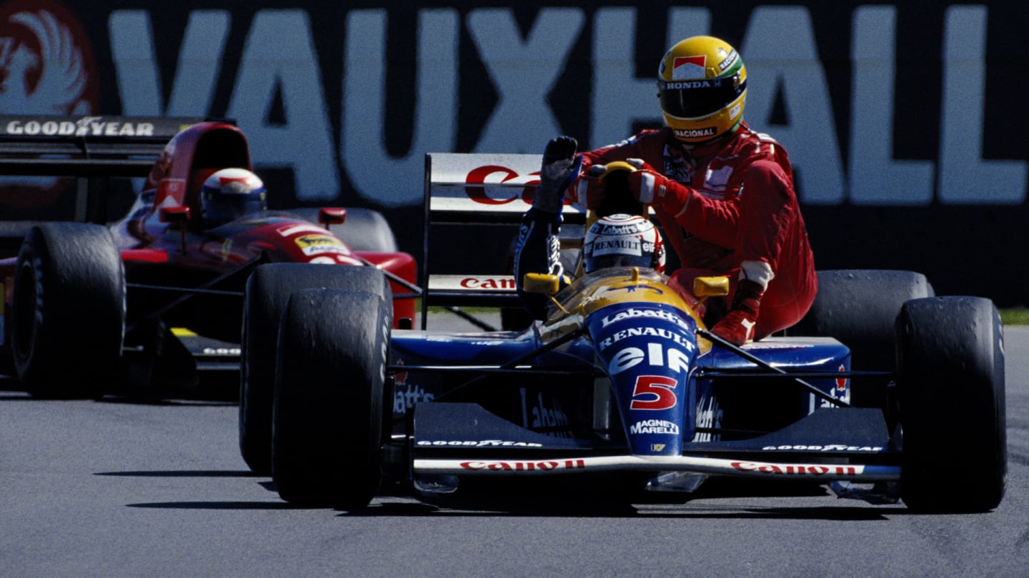 Alain Prost watches from behind as Nigel Mansell driving the #5 Canon Williams Renault Williams