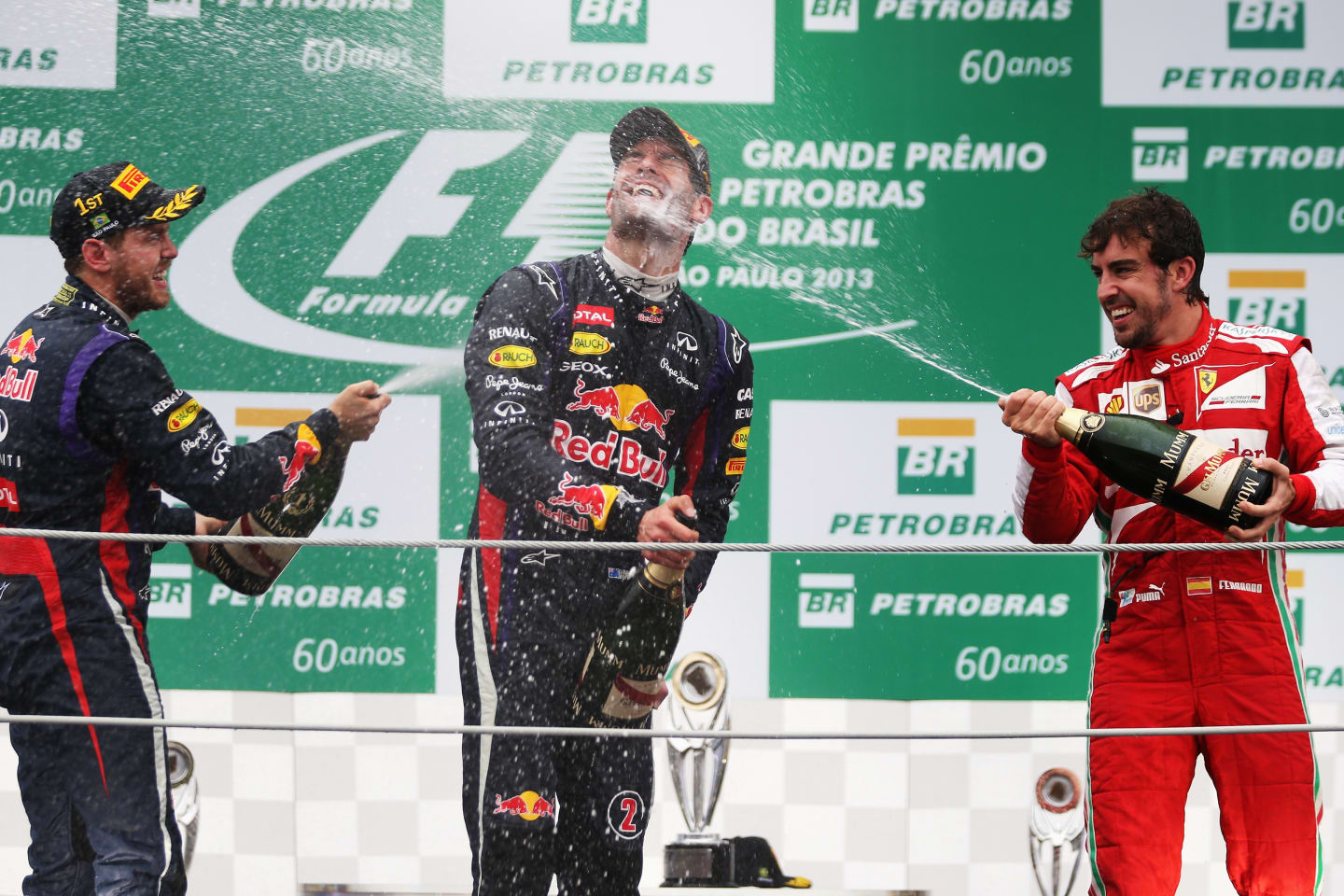 SAO PAULO, BRAZIL - NOVEMBER 24:  Race winner Sebastian Vettel (L) of Germany and Infiniti Red Bull