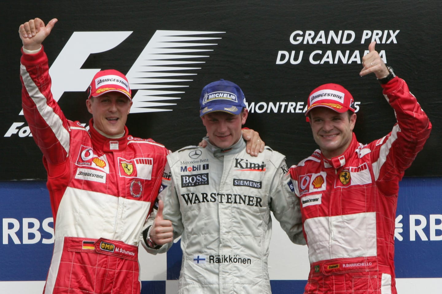 MONTREAL, CANADA - JUNE 12:  Kimi Raikkonen of Finland and Mclaren (C) celebrates his first place