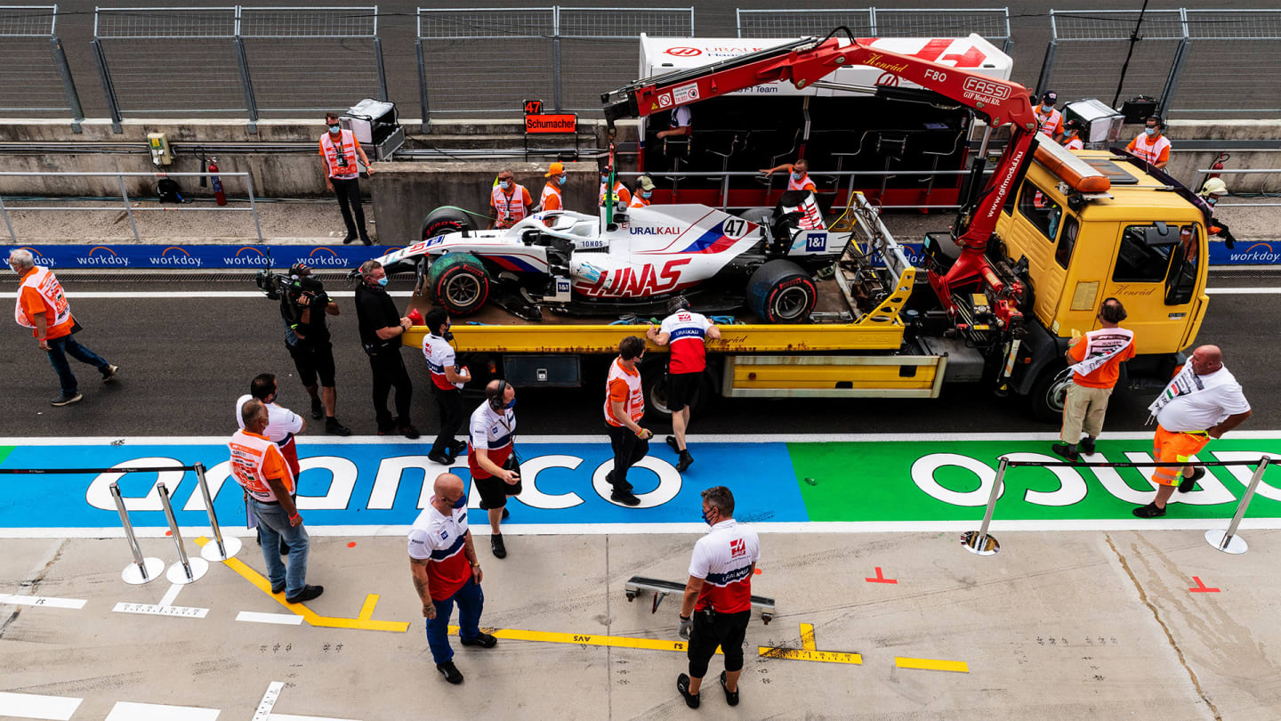 BUDAPEST, HUNGARY - JULY 31: The broken car of Mick Schumacher of Germany and Haas F1 is brought