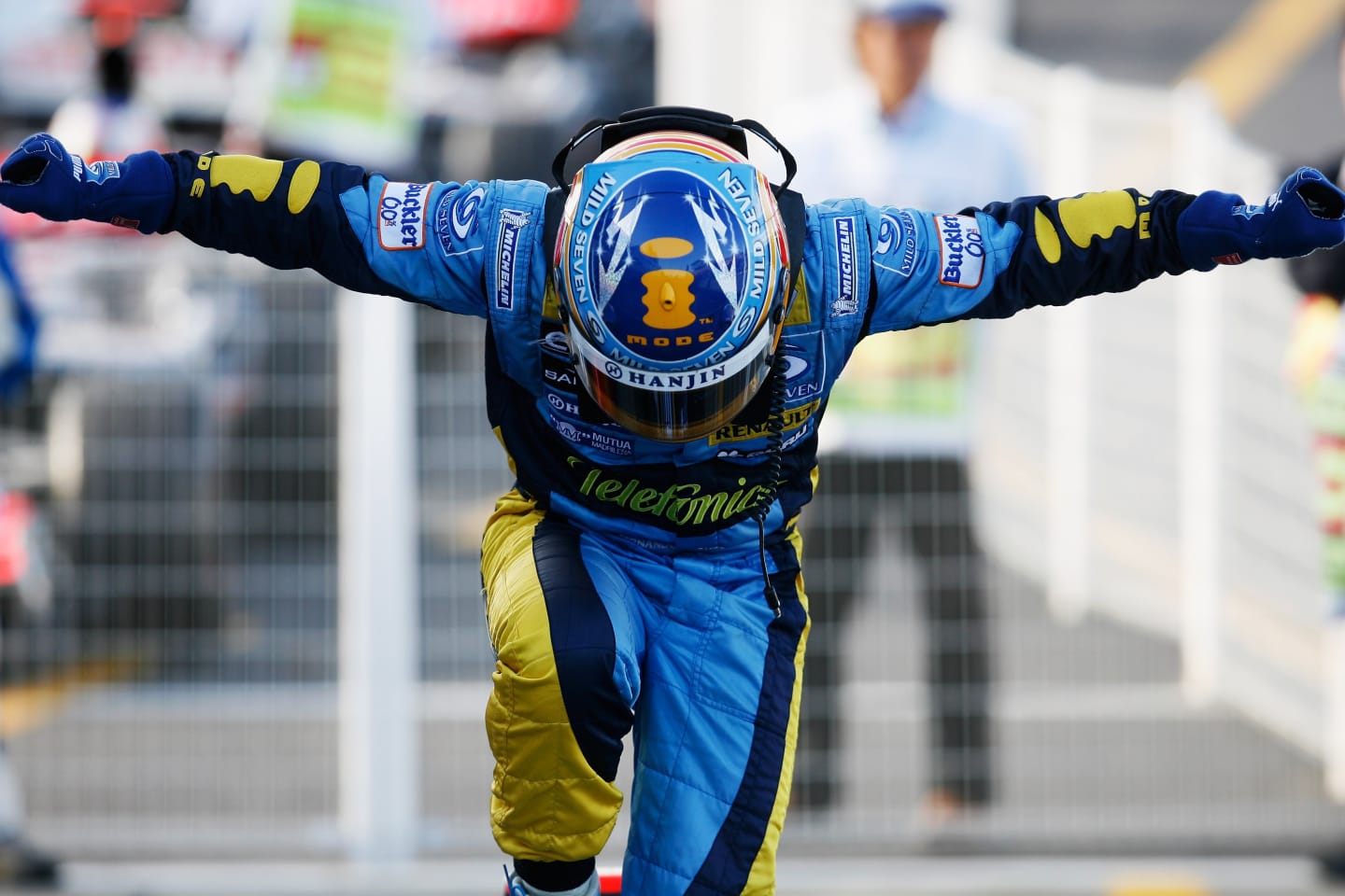 SUZUKA, JAPAN - OCTOBER 08:  Fernando Alonso of Spain and Renault celebrates his victory during the