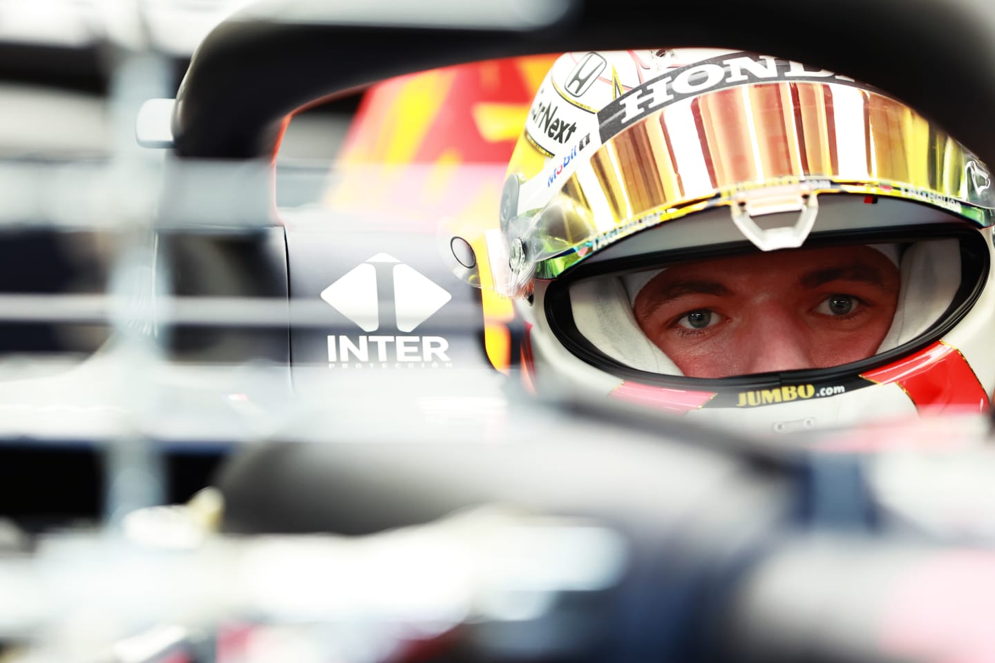 Max Verstappen deep in concentration as he prepares to leave the pits in his Red Bull RB16B