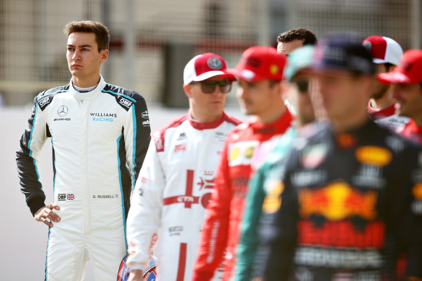 BAHRAIN, BAHRAIN - MARCH 12: George Russell of Great Britain and Williams looks on from the grid