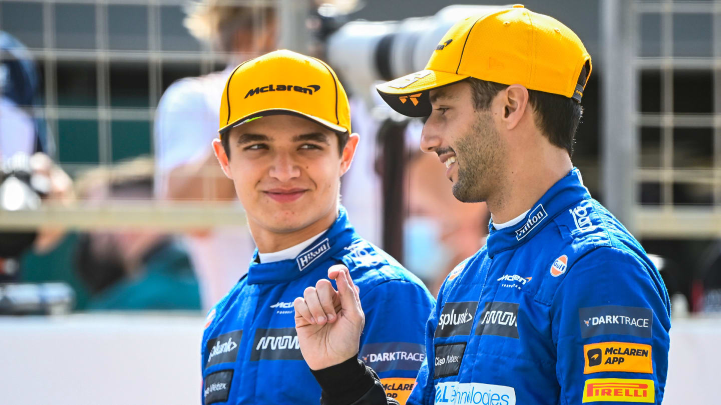 Lando Norris, McLaren, and Daniel Ricciardo, McLaren, pose on the