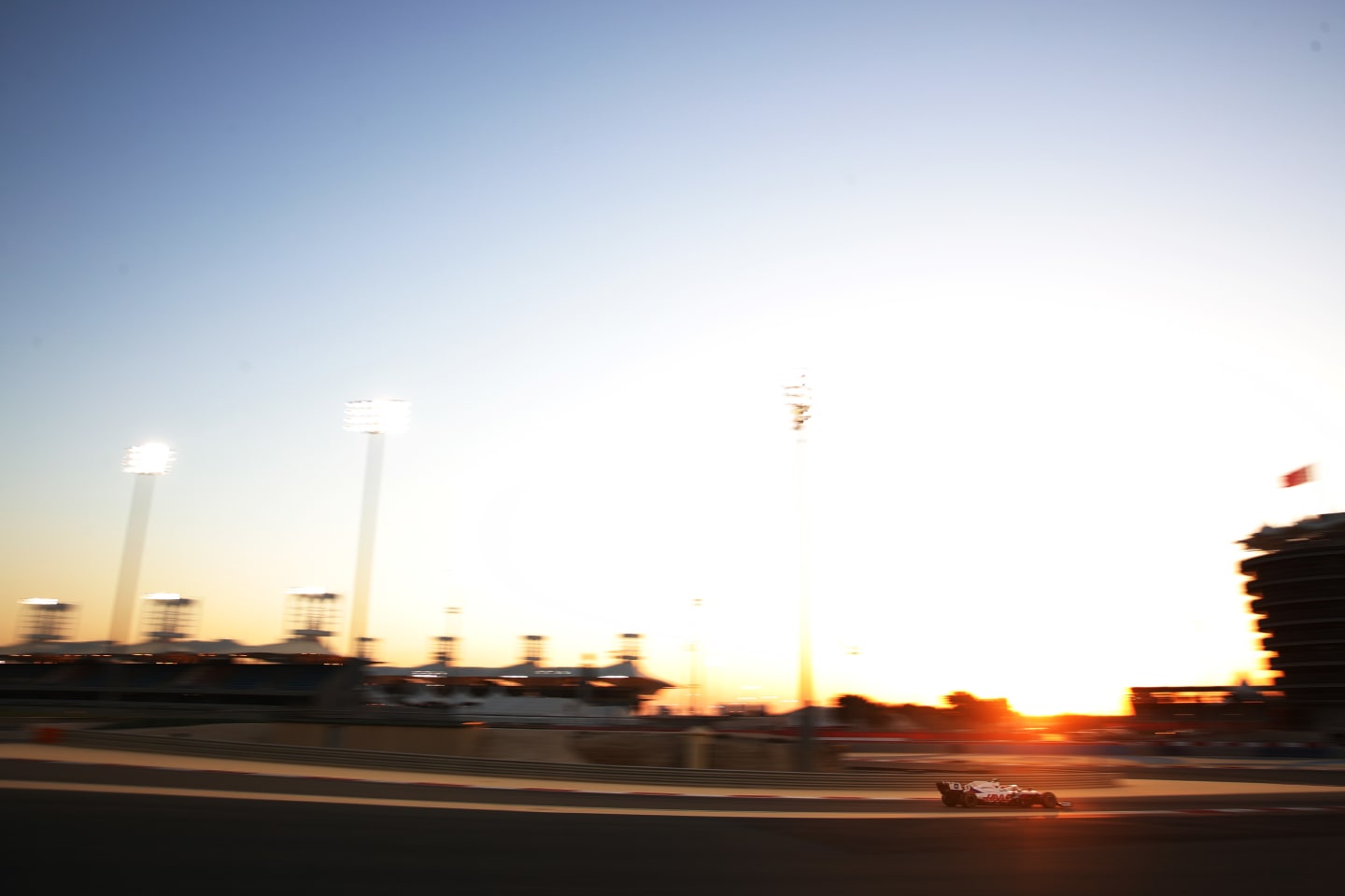 A wide-angled shot of Mazepin driving into the sunset