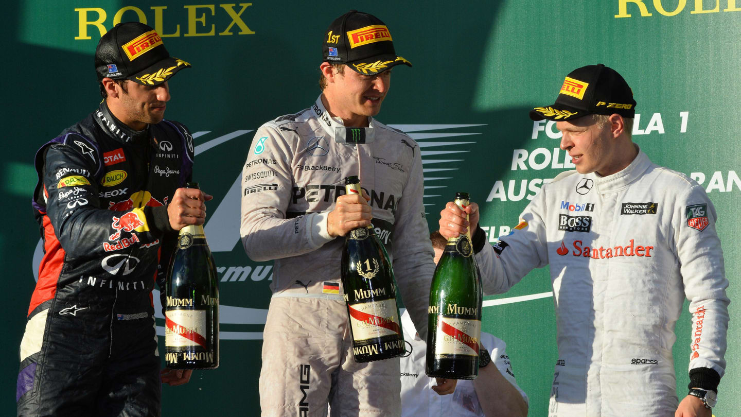 Winner Mercedes driver Nico Rosberg of Germany (C) celebrates with champagne with second-placed Red