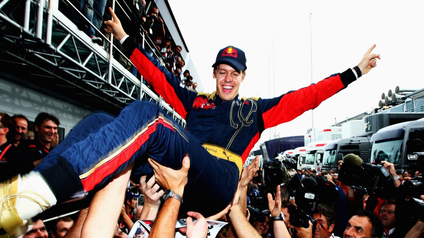 MONZA, ITALY - SEPTEMBER 14: Sebastian Vettel of Germany and Scuderia Toro Rosso is thrown high in