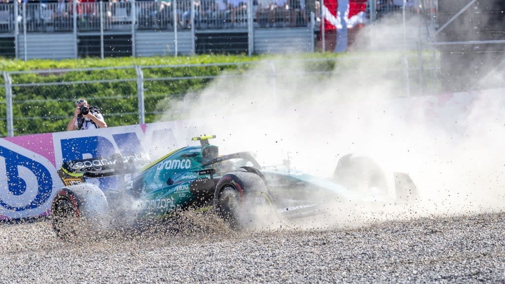 TOPSHOT - Aston Martin's German driver Sebastian Vettel drives into the gravel during the sprint qualifying at the Red Bull Ring race track in Spielberg, Austria, on July 9, 2022, ahead of the Formula One Austrian Grand Prix. (Photo by Johann GRODER / AFP) (Photo by JOHANN GRODER/AFP via Getty Images)
