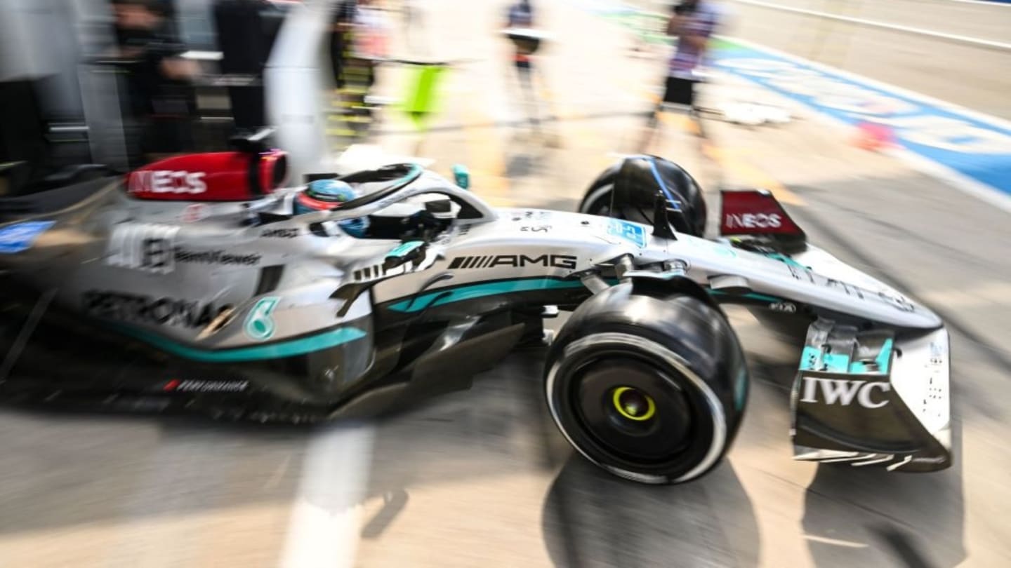 Mercedes' British driver Lewis Hamilton steers his car in the pit lane during the first practice