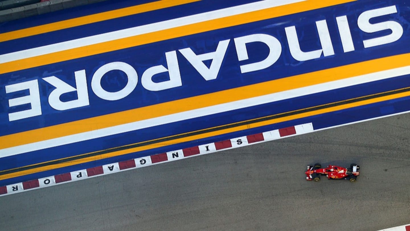 SINGAPORE - SEPTEMBER 19: Sebastian Vettel of Germany and Ferrari drives during final practice for