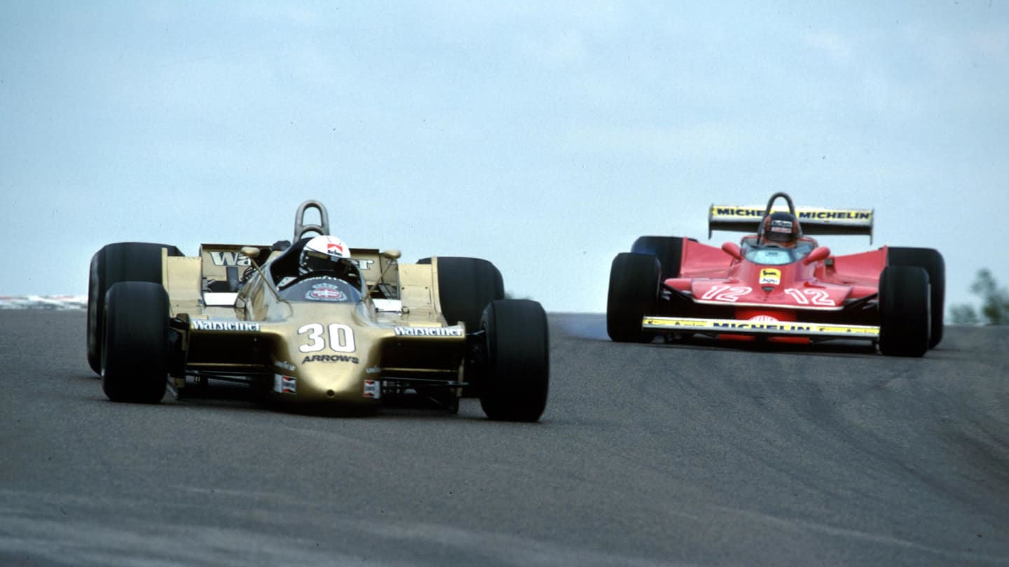 Jochen Mass in the A2 (L) with Gilles Villeneuve giving chase in the Ferrari 312 T4 (R) at Dijon, 1979
