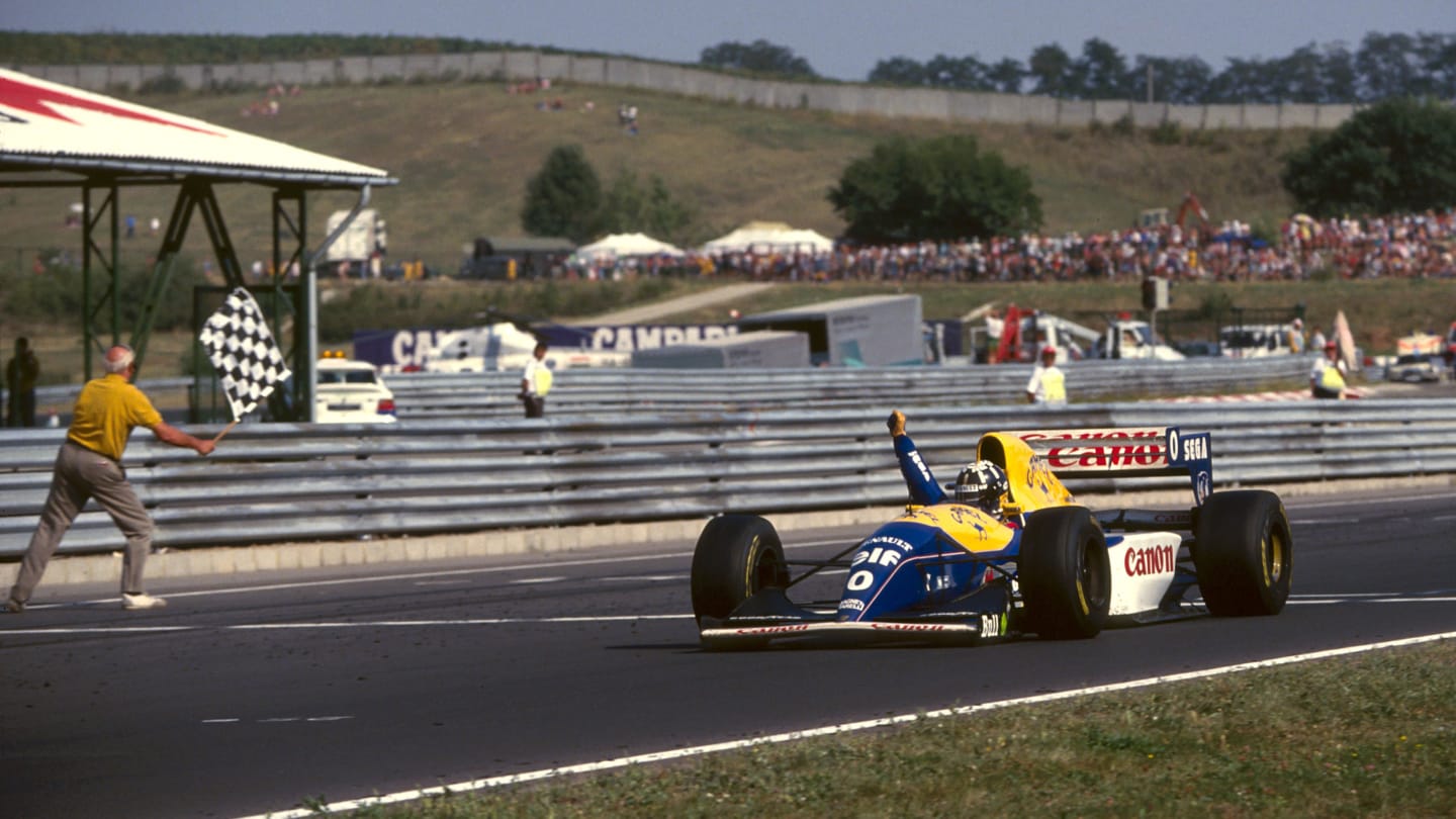 Damon Hill (GBR), Williams Renault FW15C, celebrates his debut Grand Prix win.
Hungarian Grand