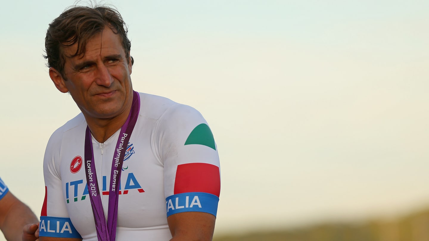 LONGFIELD, ENGLAND - SEPTEMBER 08: Alessandro Zanardi of Italy celebrates winning the Silver Medal