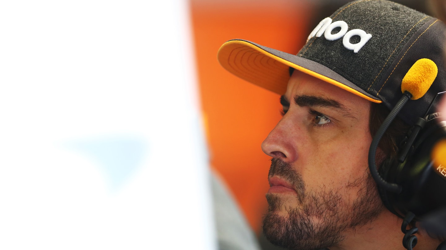 MONZA, ITALY - SEPTEMBER 06: Fernando Alonso of Spain and McLaren F1 looks on in the garage during