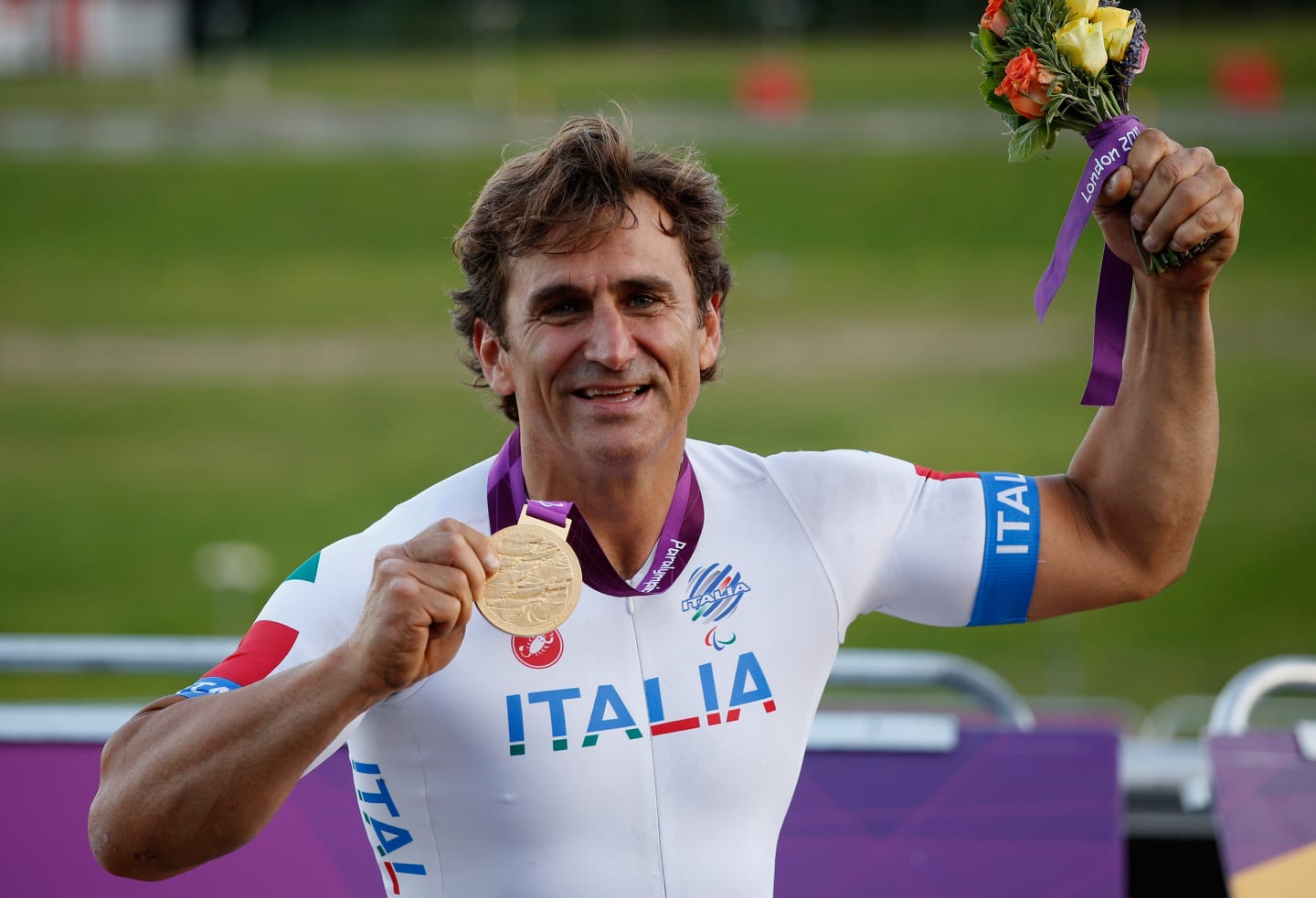 LONGFIELD, ENGLAND - SEPTEMBER 07:  Alessandro Zanardi of Italy poses with his Gold medal after