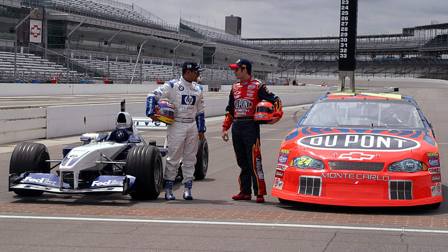 NASCAR's Jeff Gordon (R) of the US and F-1's Juan Pablo Montoya of Columbia talk before trading