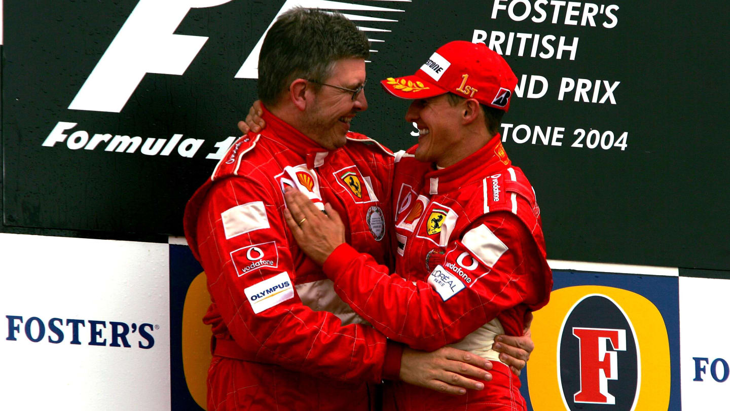 The podium (L to R): Ross Brawn (GBR) Ferrari Technical Director with race winner Michael