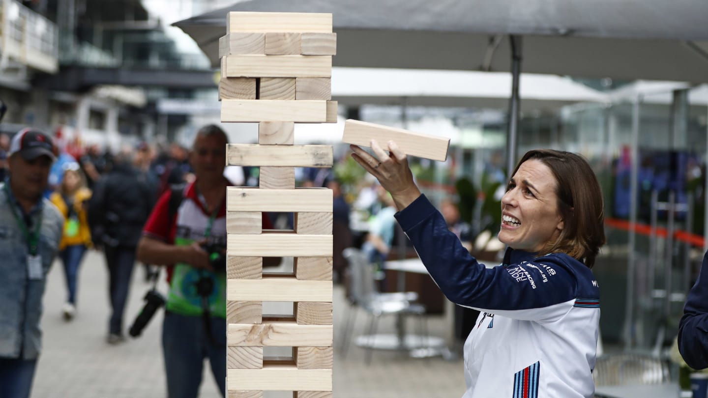 Claire Williams, Deputy Team Principal, Williams Racing, plays a giant Jenga game during the Brazilian GP on November 09, 2018 in Autodromo Jose Carlos Pace, Brazil. (Photo by Glenn Dunbar / LAT Images)