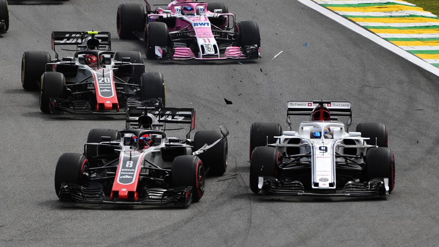 Marcus Ericsson, Alfa Romeo Sauber C37 and Romain Grosjean, Haas F1 Team VF-18 collide at the start of the race during the Brazilian GP on November 11, 2018 in Autodromo Jose Carlos Pace, Brazil. (Photo by Mark Sutton / Sutton Images)