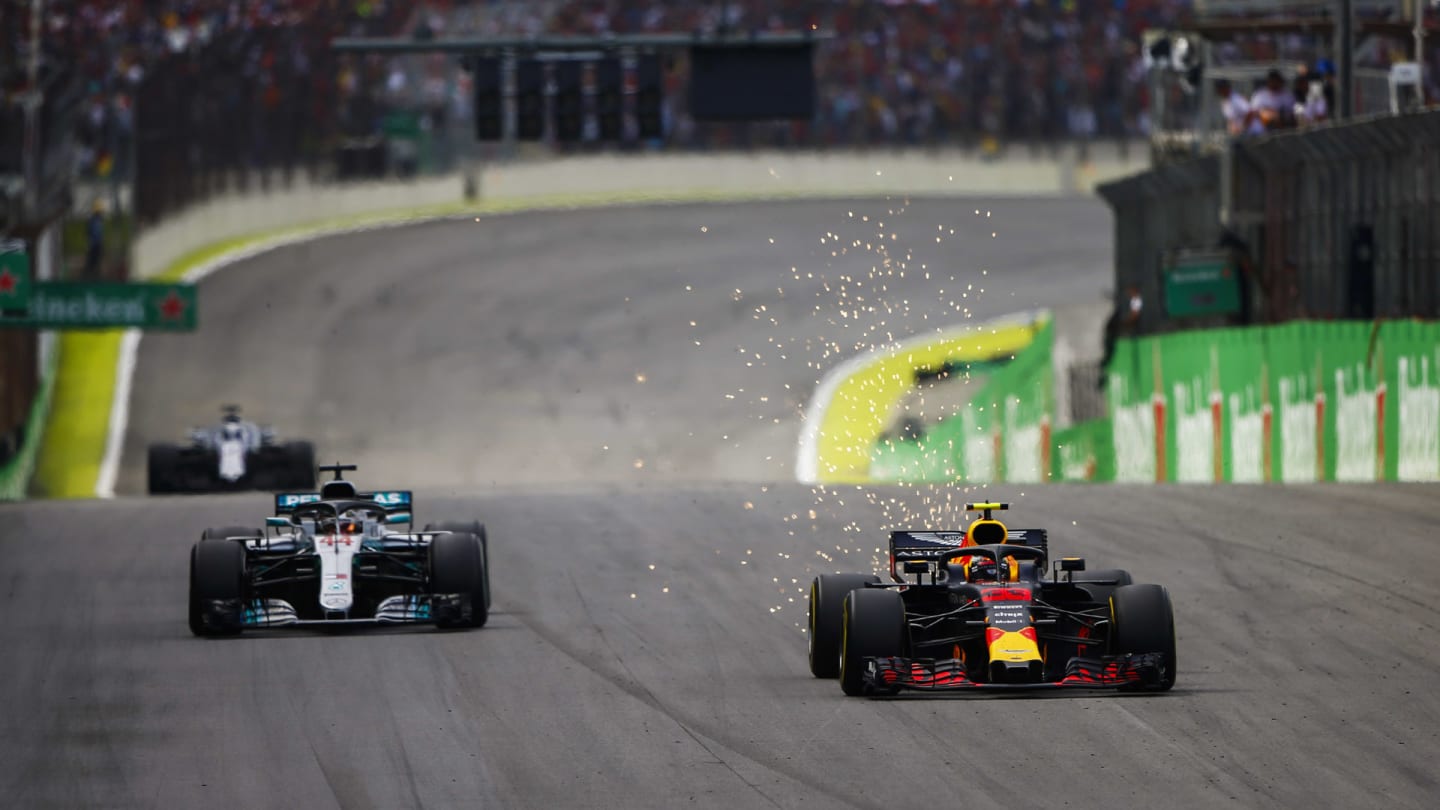 Max Verstappen, Red Bull Racing RB14, passes Lewis Hamilton, Mercedes AMG F1 W09 EQ Power+, for the lead during the Brazilian GP on November 11, 2018 in Autodromo Jose Carlos Pace, Brazil. (Photo by Andy Hone / LAT Images)