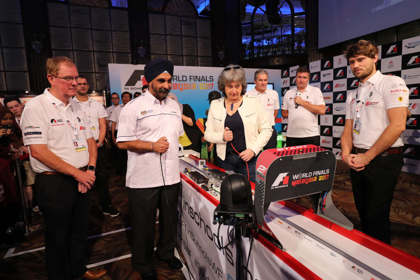 Opening ceremony flag-off race, with Dr Mehander Singh and Vicki Treadell, F1 in Schools World