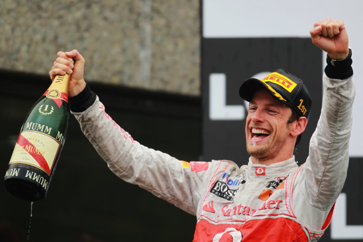 MONTREAL, CANADA - JUNE 12:  Jenson Button of Great Britain and McLaren celebrates on the podium