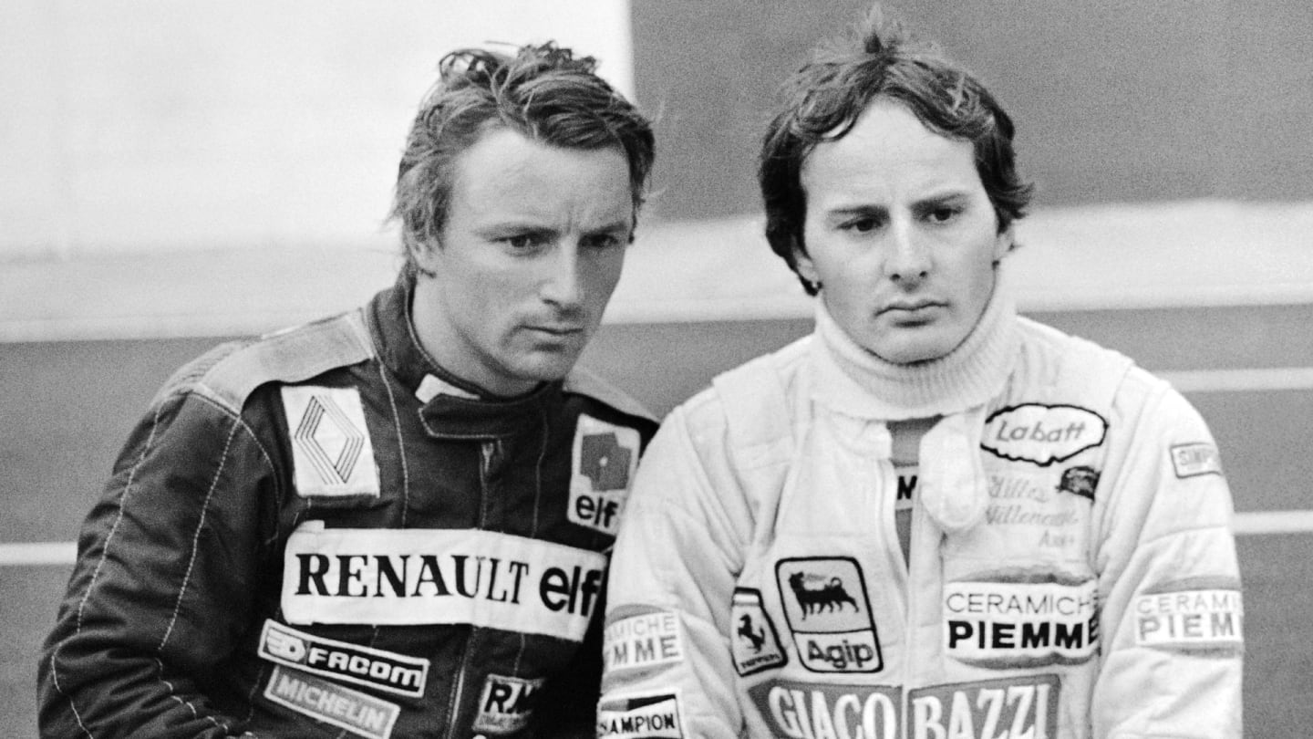 Ferrari driver Gilles Villeneuve of Canada (R) and Renault driver René Arnoux of France attend the