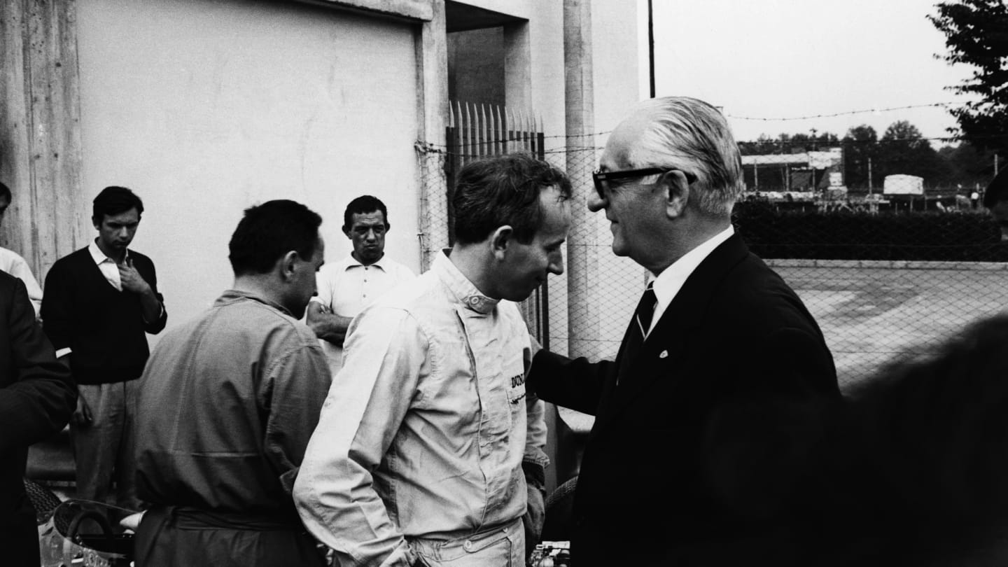 Monza, Italy. 6th September 1964. Rd 8. 
John Surtees with Ferrari team boss Enzo Ferrari talk in