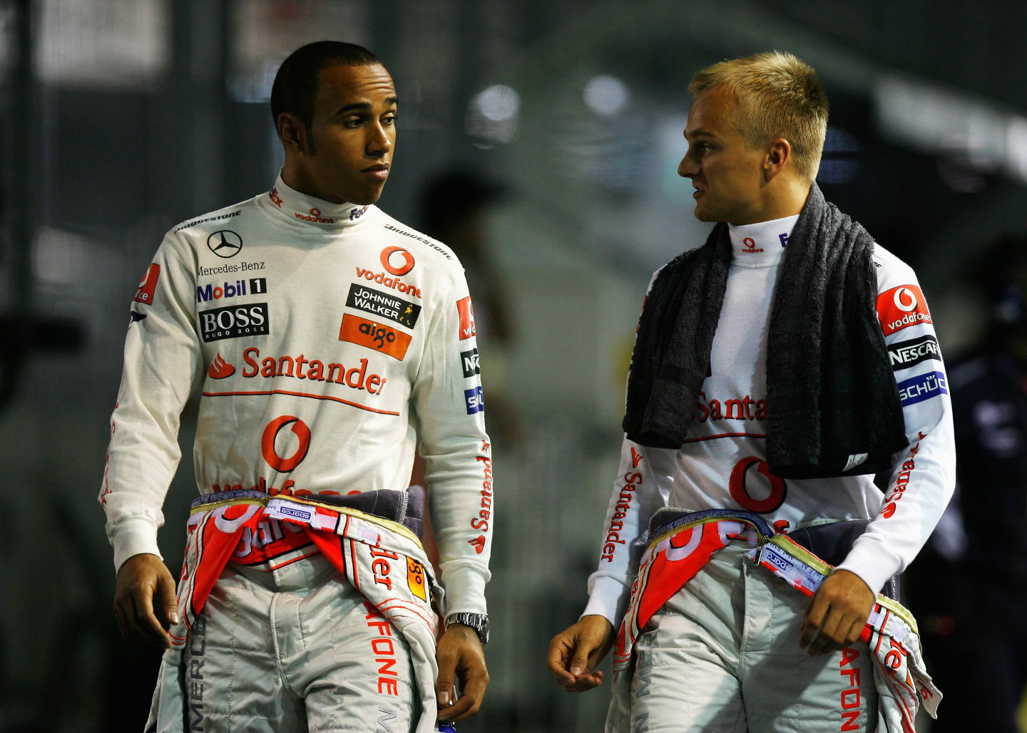 SINGAPORE - SEPTEMBER 27:  (L-R) Lewis Hamilton of Great Britain and McLaren Mercedes and Heikki