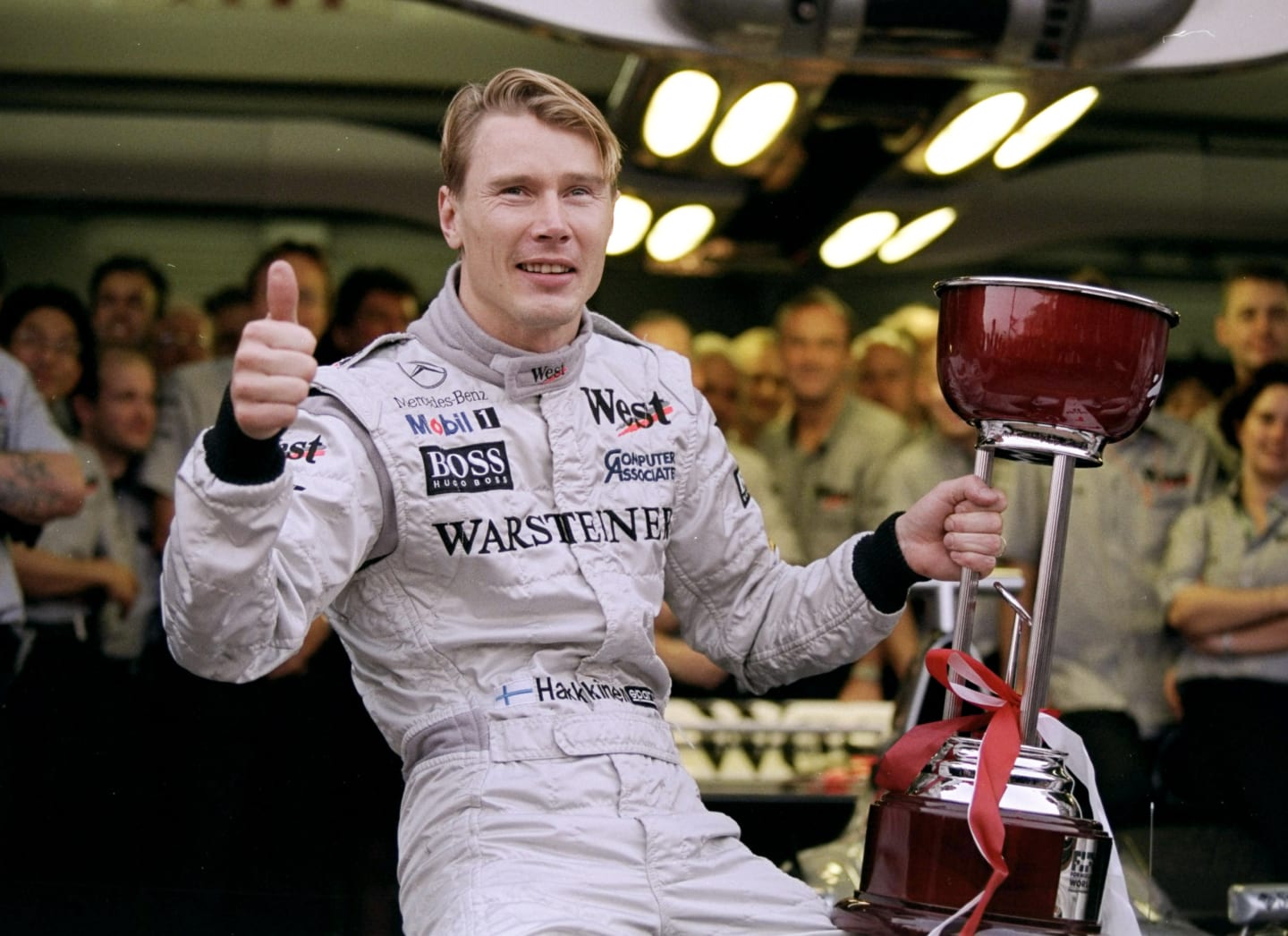 1 Nov 1998:  Race winner Mika Hakkinen of Finland racing for Mercedes McLaren poses for pictures