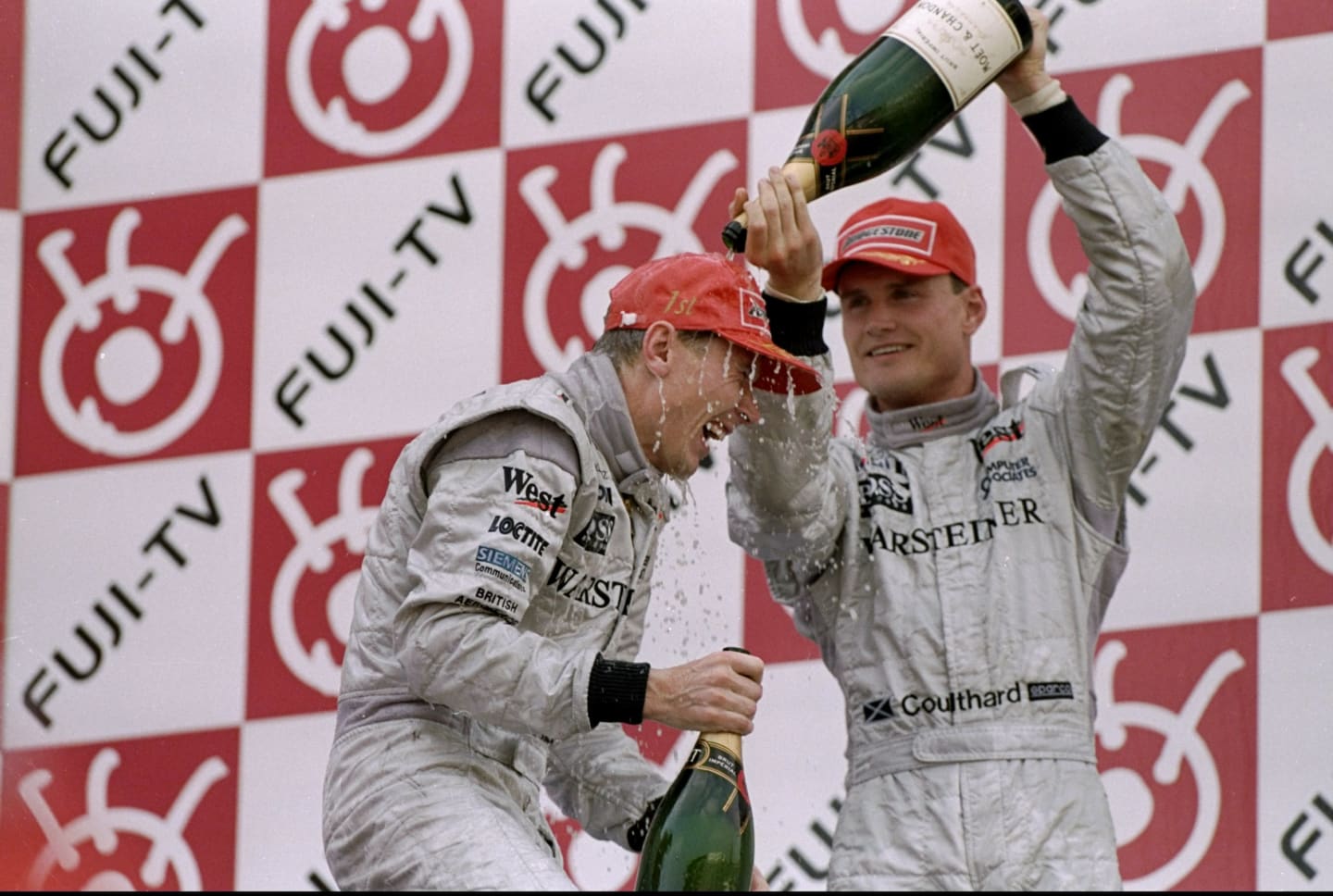 1 Nov 1998:  Race winner Mika Hakkinen of Finland racing for Mercedes McLaren is soaked with