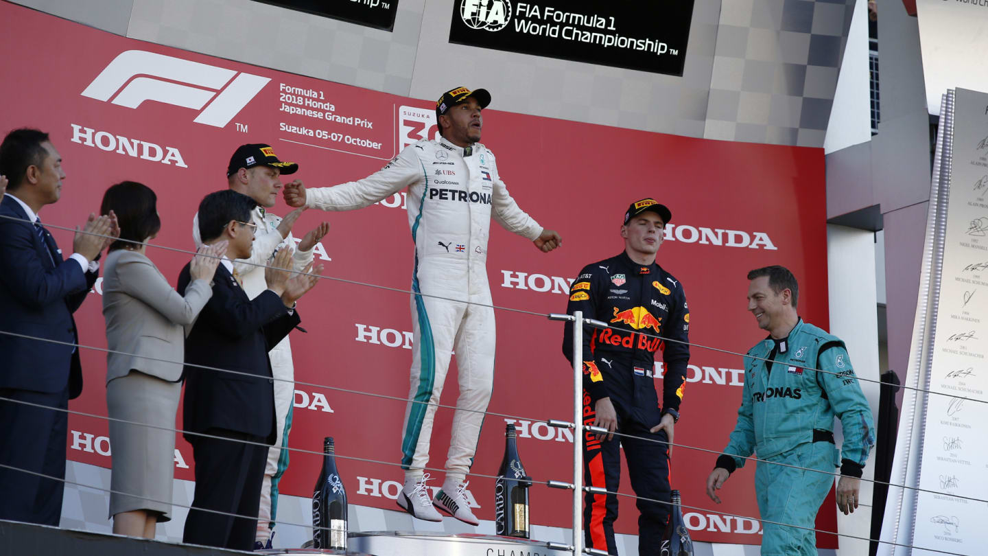 SUZUKA, JAPAN - OCTOBER 07: (L to R): Valtteri Bottas, Mercedes AMG F1, Lewis Hamilton, Mercedes AMG F1 and Max Verstappen, Red Bull Racing celebrate on the podium during the Japanese GP at Suzuka on October 07, 2018 in Suzuka, Japan. (Photo by Manuel Goria / Sutton Images)