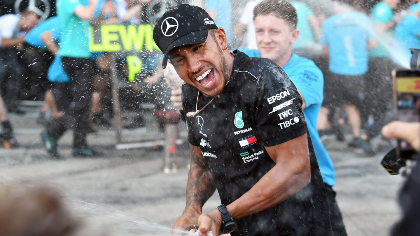 SUZUKA, JAPAN - OCTOBER 07: Lewis Hamilton, Mercedes AMG F1 celebrates with the team and the champagne during the Japanese GP at Suzuka on October 07, 2018 in Suzuka, Japan. (Photo by Mark Sutton / Sutton Images)