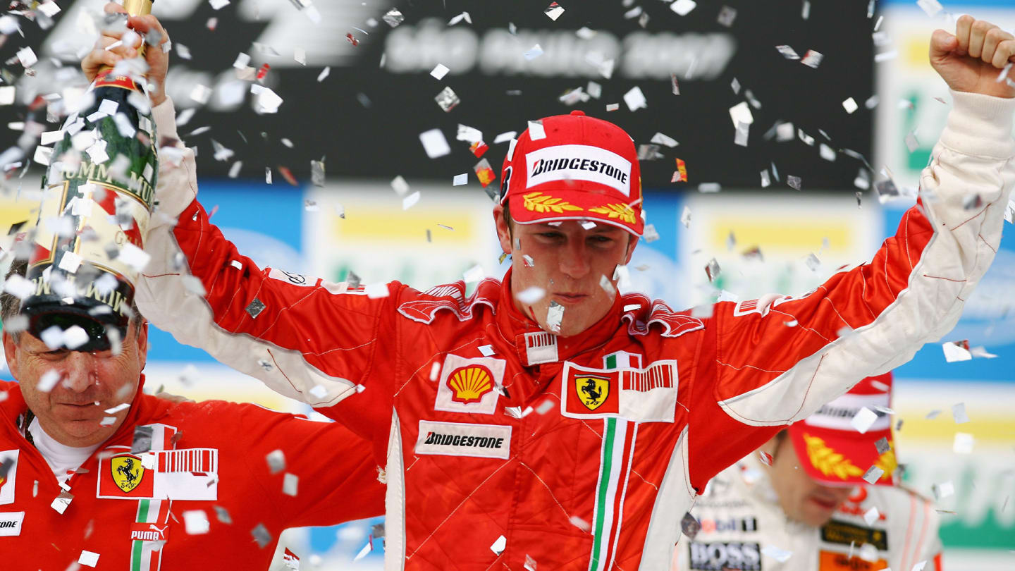 SAO PAULO, BRAZIL - OCTOBER 21: Kimi Raikkonen of Finland and Ferrari celebrates on the podium