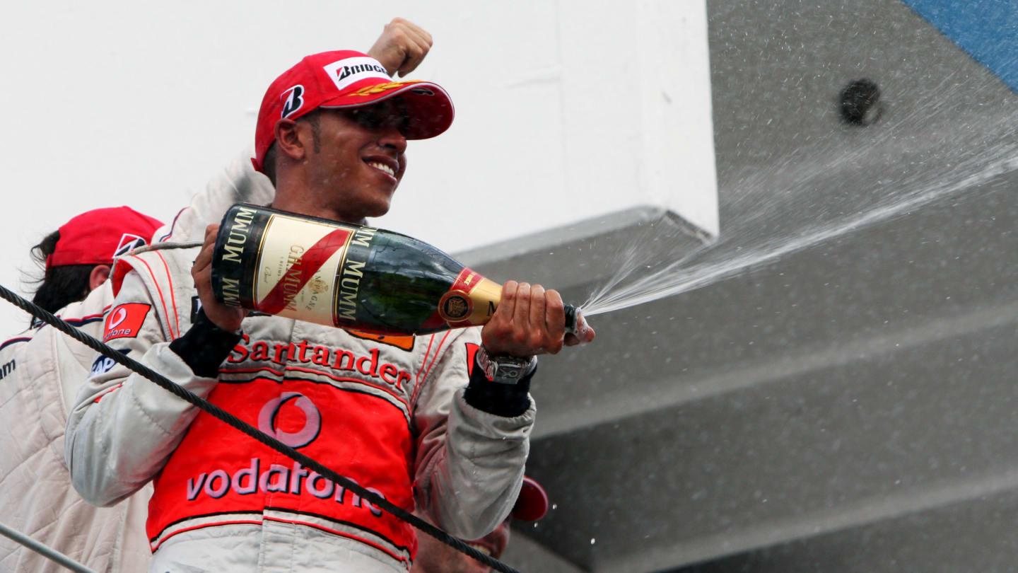 Lewis Hamilton (GBR) McLaren celebrates his third position on the podium.
Formula One World