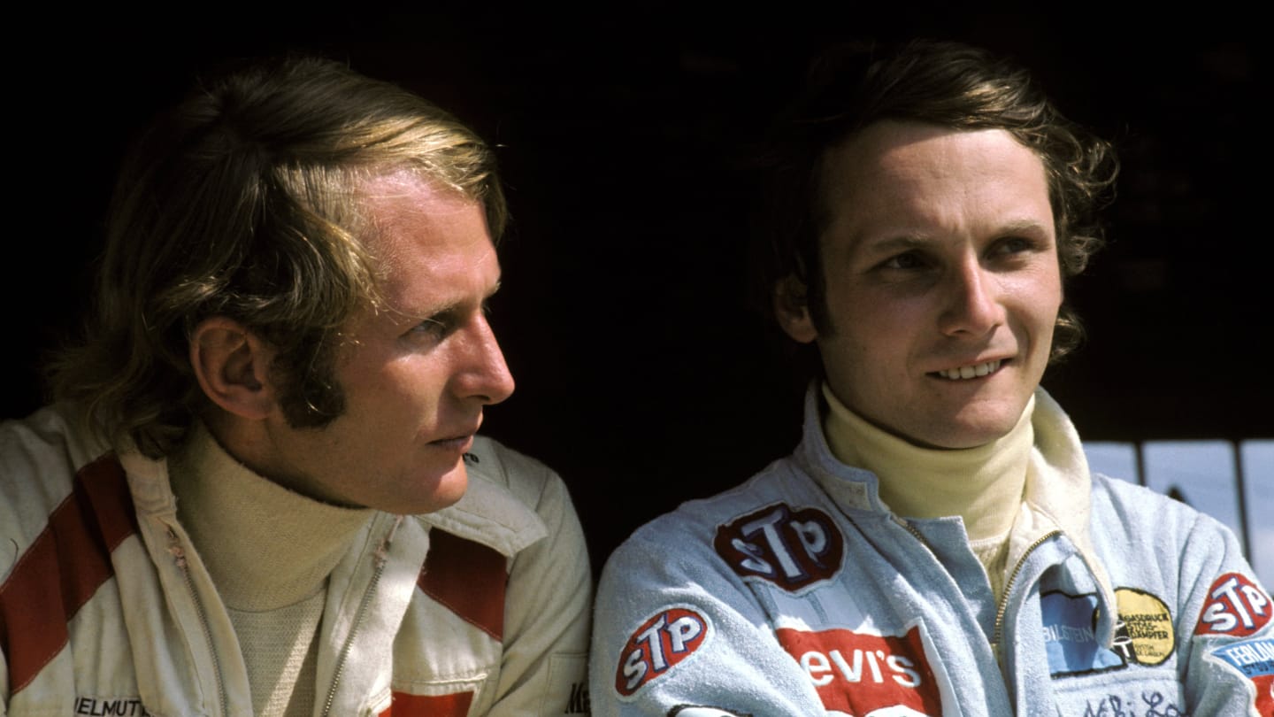 (L to R): Helmut Marko (AUT) BRM, who finished fourteenth, talks with Niki Lauda (AUT) March who