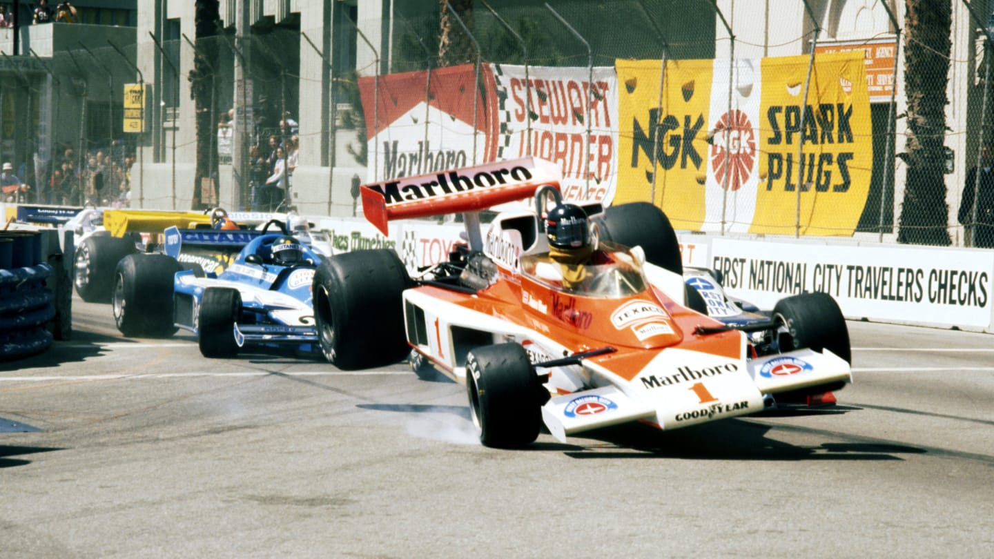 James Hunt (GBR) McLaren M23 flies into the air as he collides with John Watson (GBR) Brabham BT45B