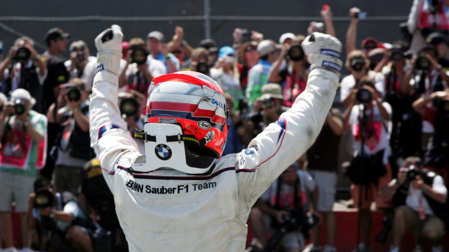 Robert Kubica (POL) BMW Sauber F1 celebrates his first win in parc ferme.
Formula One World