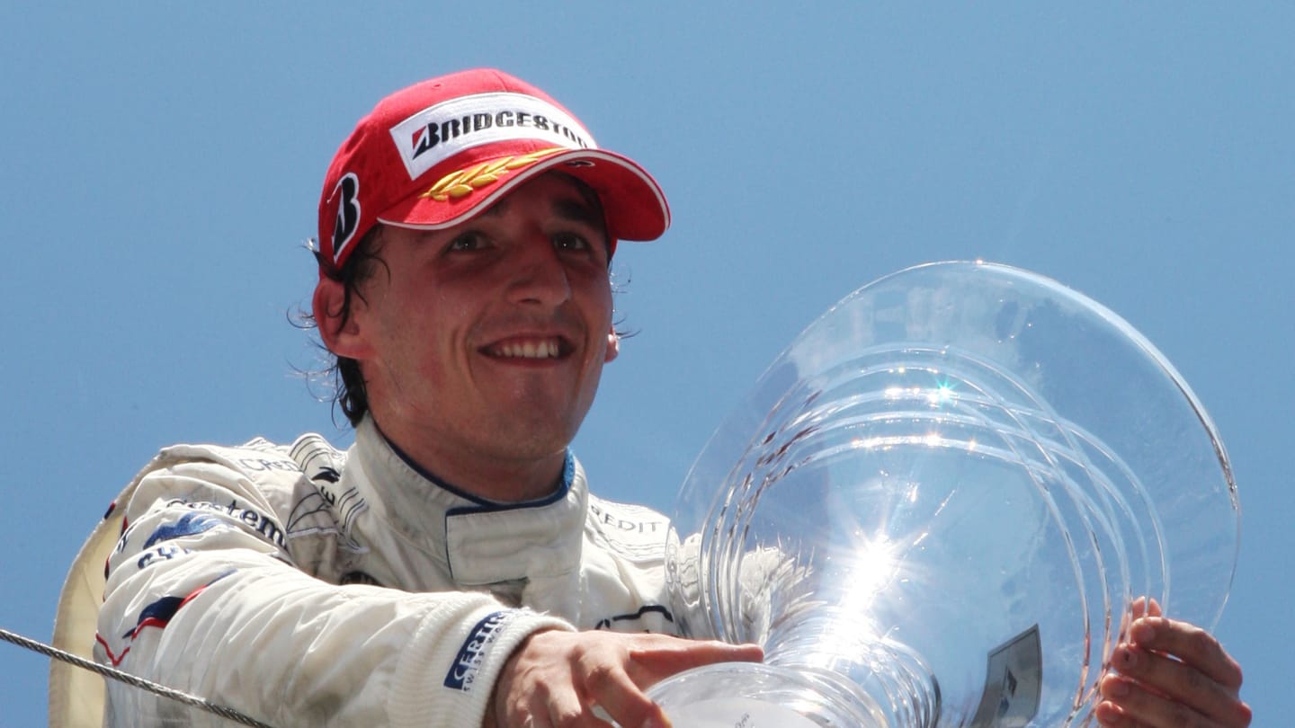 Robert Kubica (POL) BMW Sauber F1 celebrates his first GP win on the podium.
Formula One World