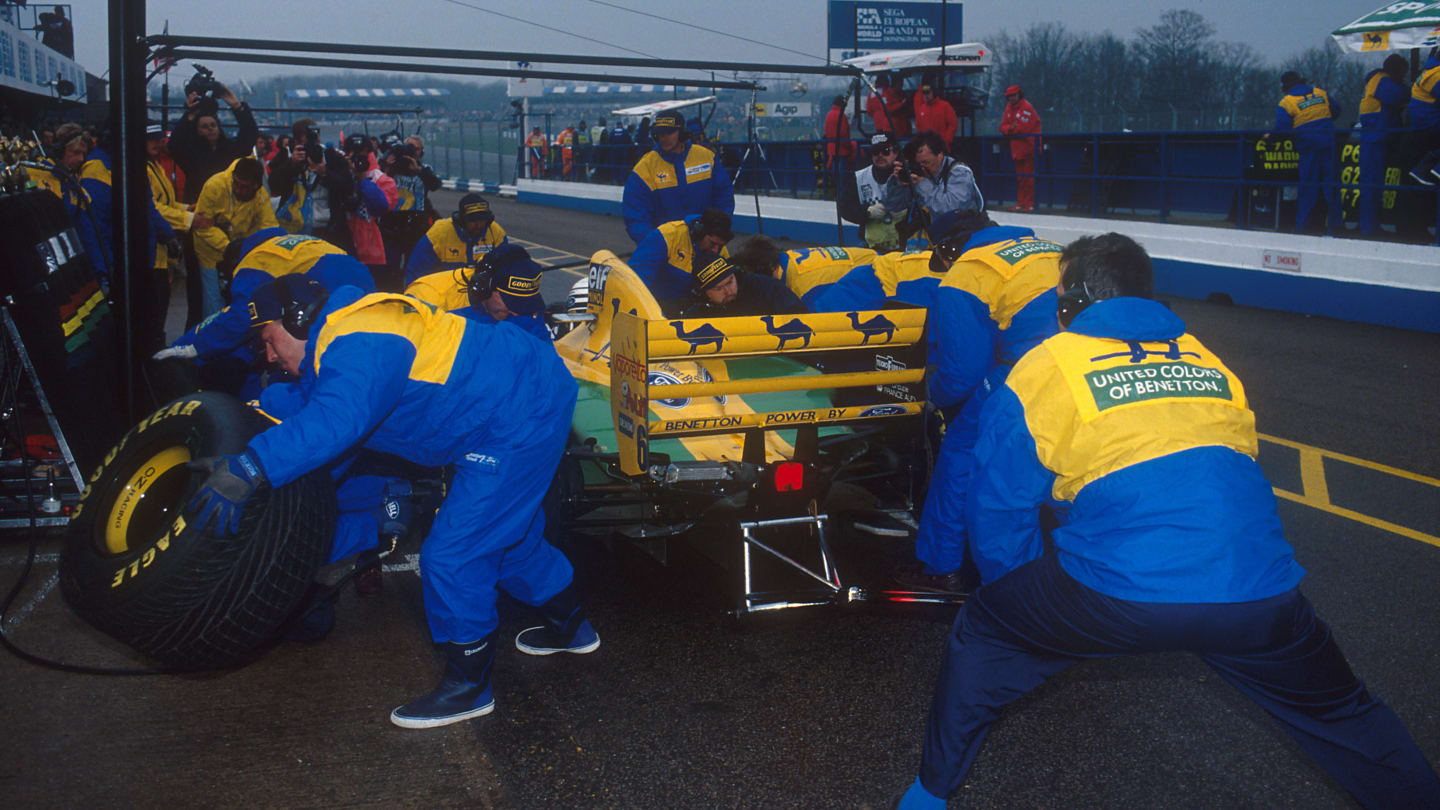 Benetton's crew, seen here changing the tyres on Riccardo Patrese's car at the 1993 European Grand Prix, were standard setters for pit stops pre-1994. © LAT Photographic